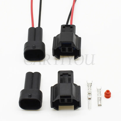 Close-up view of 2-pin automotive male connector with sealed terminals for secure electrical connection