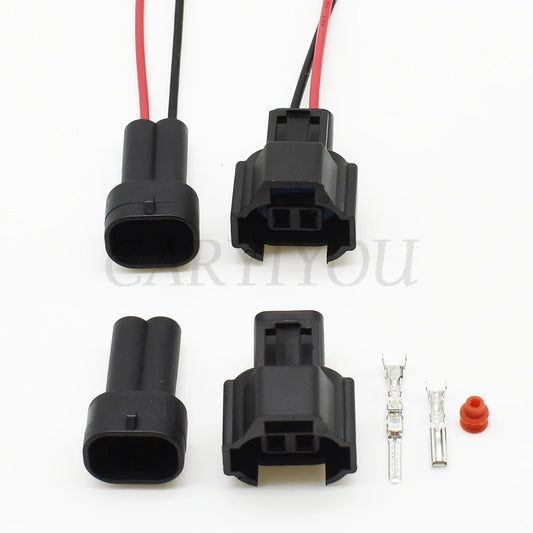 Close-up view of 2-pin automotive male connector with sealed terminals for secure electrical connection