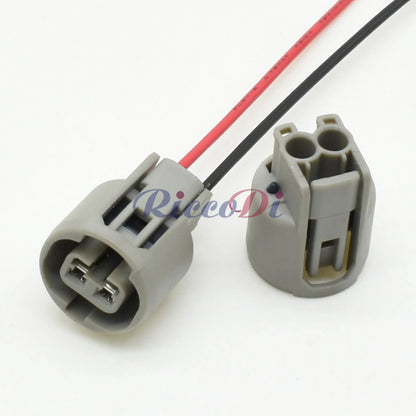 Close-up of 2-pin automotive connector plug highlighting precise pin alignment and secure housing