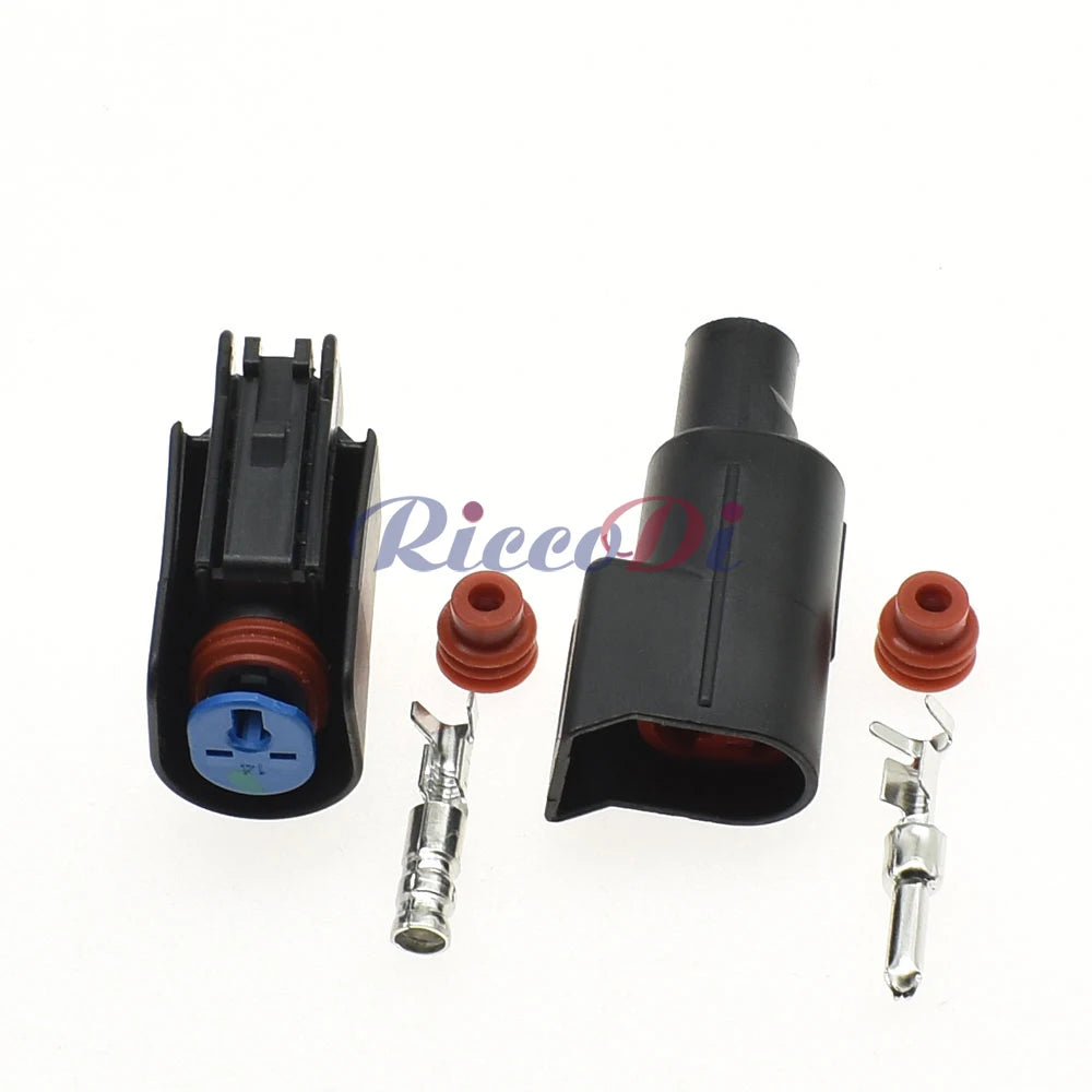 Close-up of male and female terminals in automotive plastic connector for secure and reliable wire connections