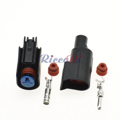 Close-up of male and female terminals in automotive plastic connector for secure and reliable wire connections