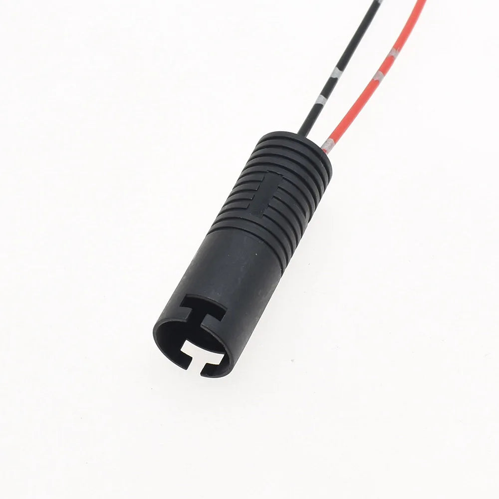 Close-up of male plug terminals on automotive headlight wire harness connector for secure connection