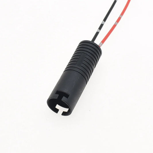 Close-up of male plug terminals on automotive headlight wire harness connector for secure connection
