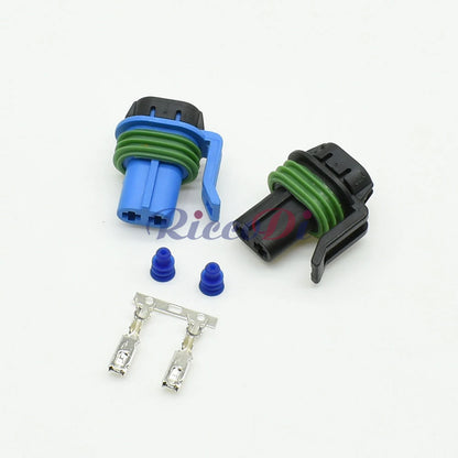 Close-up of 2 pin terminals on automotive fog light wire harness connector for secure connection