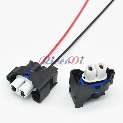 Close-up of 2 hole waterproof automotive fog light connector with pins and rubber seals