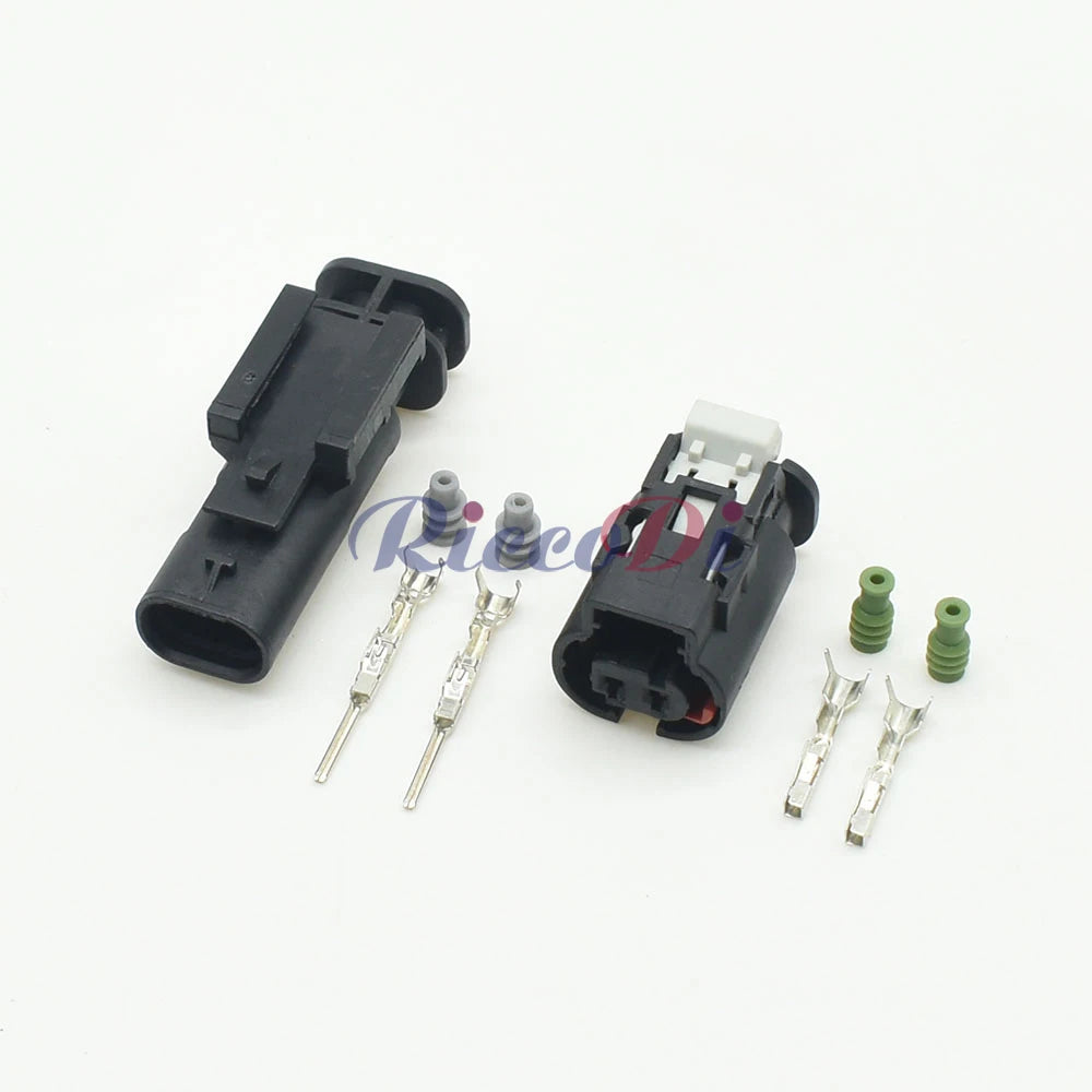 Close-up of terminals on automotive urea sensor and fuel nozzle connector for secure electrical connection