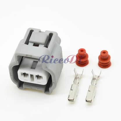 Automotive reversing light wiring application using gearbox connector plug