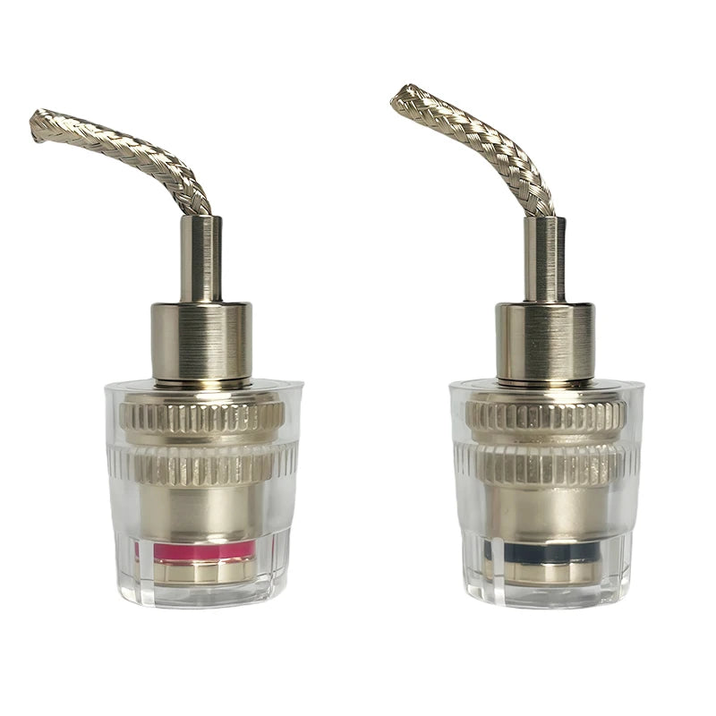 Clear speaker binding posts showing banana plug sockets and gold-plated copper terminals for HiFi audio equipment