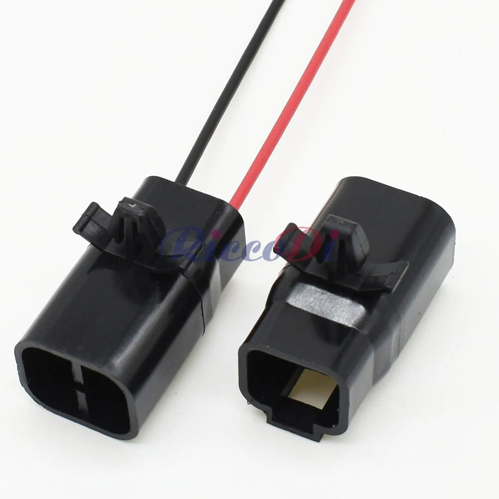 Close-up view of black 2 pin male automotive connector showing detailed pin design and construction