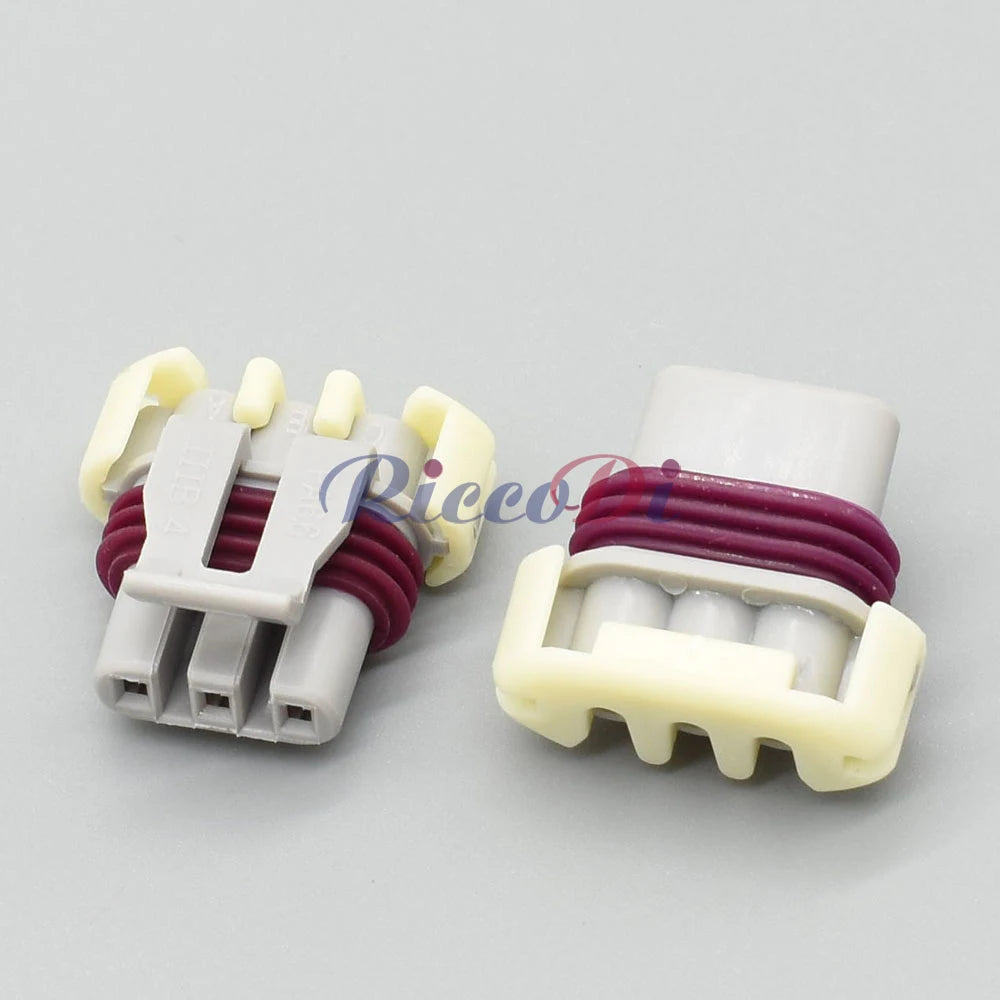 Close-up of 3-Pin terminals of Buick and Chevrolet ignition coil connector 121209946 for secure electrical connection