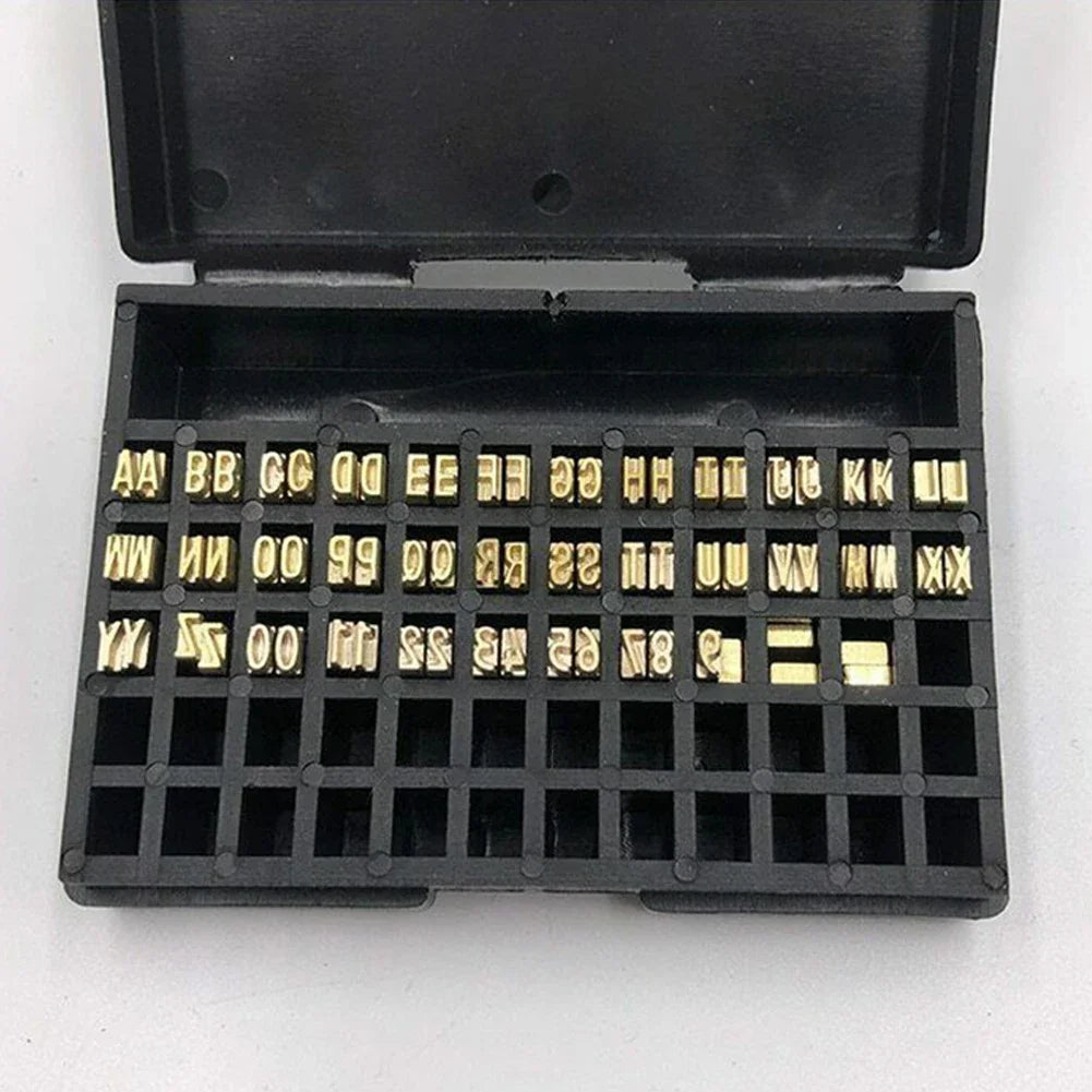 Close-up of 2×4×15mm copper letters for coding machines, suitable for thermal ribbon printing