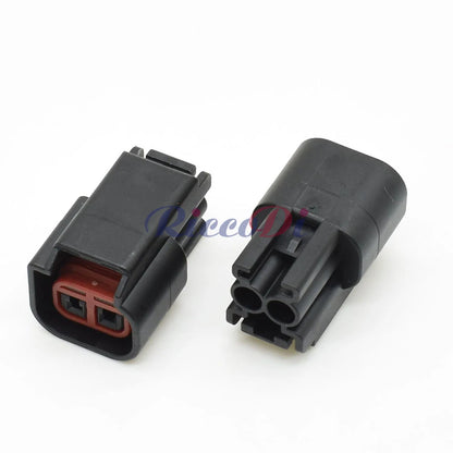 Terminal view of automotive dashboard wiring harness plug displaying reliable contact points for ignition coil