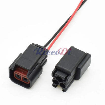 Side view of 2 pin automotive wiring harness connector showing secure terminals for ignition coil and speaker