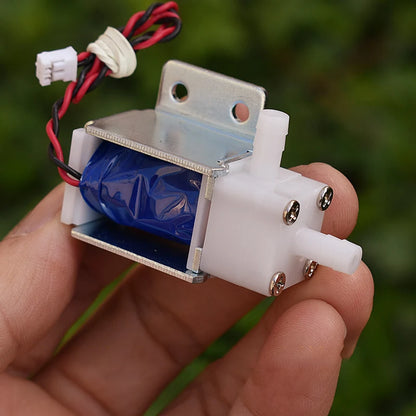 Close-up of DC 12V 18V 24V mini solenoid valve, normally open for air and water flow control, DIY garden use