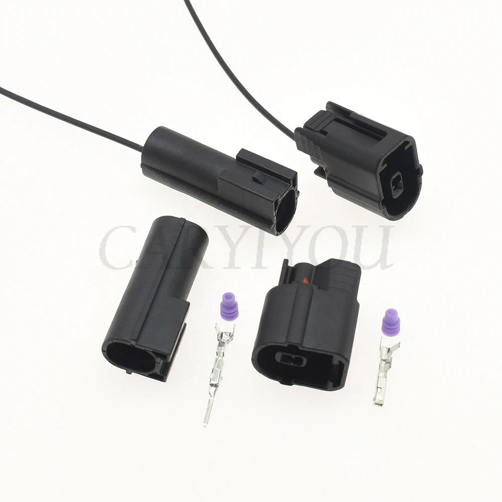 Male and female automotive connector integrated into wiring harness for secure vehicle electrical system connections