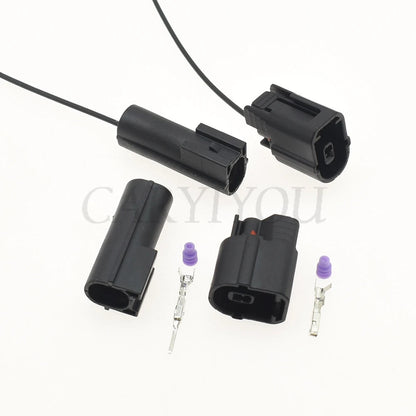 Male and female automotive connector integrated into wiring harness for secure vehicle electrical system connections
