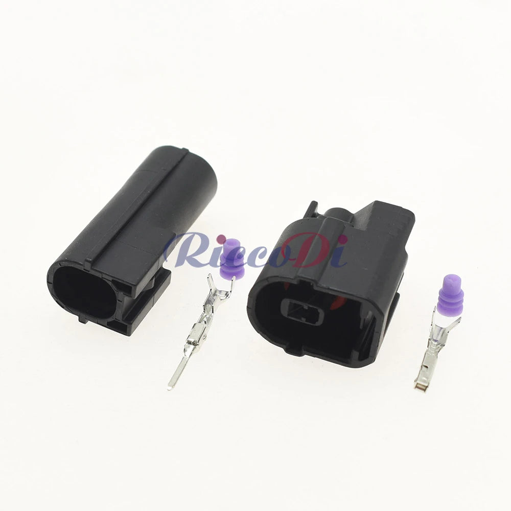 Close-up of male and female connector terminals showing pin and socket interface for reliable automotive electrical connection