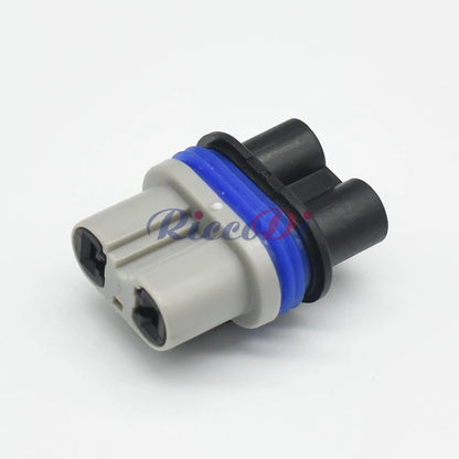 Close-up of 2.8mm 2 pin male and female wiring connector for precise automotive connections