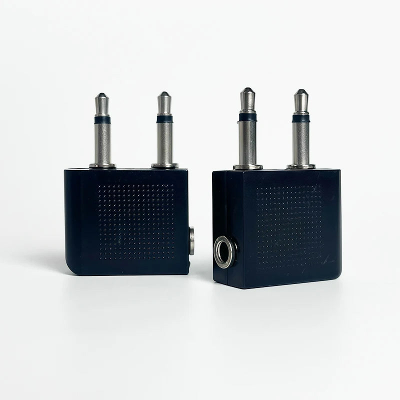 Close-up of dual 3.5mm mono male to 3.5mm stereo female aviation audio adapter for headphone connection