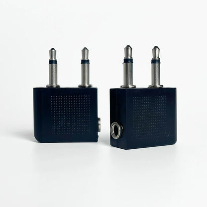 Close-up of dual 3.5mm mono male to 3.5mm stereo female aviation audio adapter for headphone connection