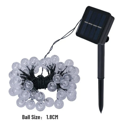 Garden party and Christmas solar crystal globe LED fairy lights close up