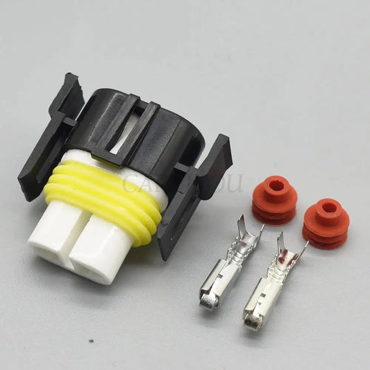 Close-up of H11 2 pin automotive wiring connector showing sealed ceramic female socket