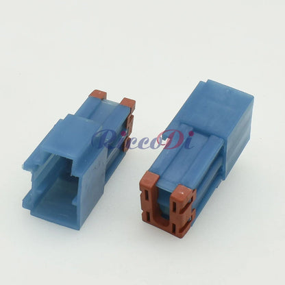 Close-up of high current automotive connector showing male and female terminals for secure electrical connections