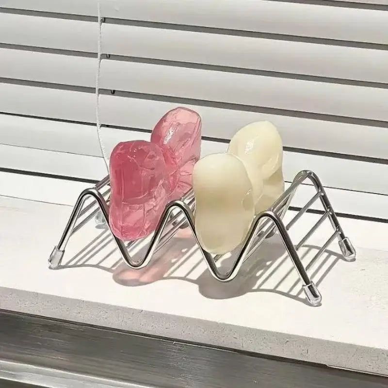 Household sink storage rack for soap and accessories