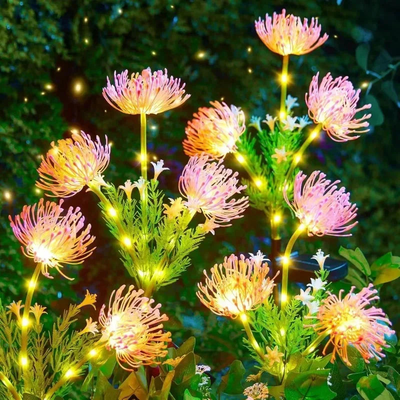 Detailed view of solar LED lily flower lamp stems with 3 glowing flower heads for outdoor decoration