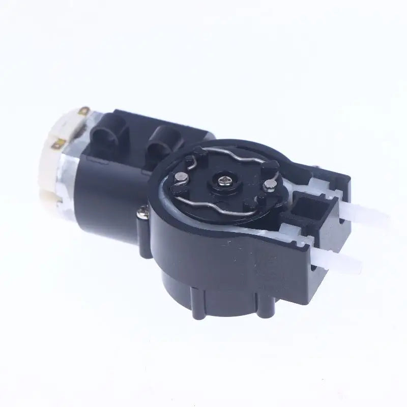 Compact liquid dosing pump accessory for self-priming operation