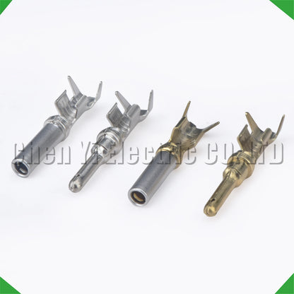 Close-up of 2.3mm male and female wire crimp pins for automotive connectors
