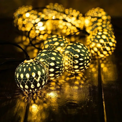 Close-up of Moroccan iron ball lamp LED string light, outdoor solar decorative lighting for patio and garden