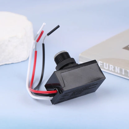 Outdoor photocell sensor switch for automatic street light activation