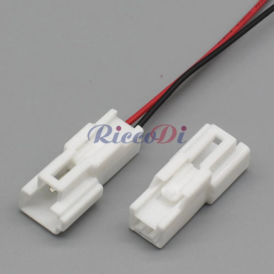 Close-up of terminals on 2-pin parking sensor connector showing secure electrical connection