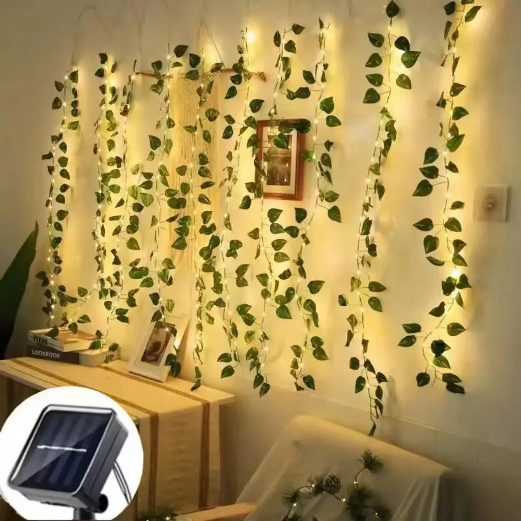 Close-up of green LED fairy lights with pothos leaves, solar powered, ideal for home wall, wedding, and Christmas decoration