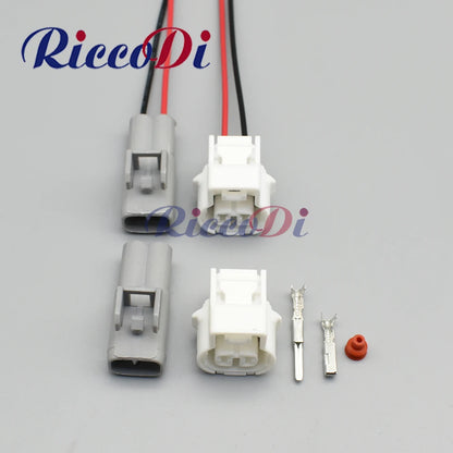 Sealed automotive wiring harness connector with female plug socket and terminals for vehicle electrical systems