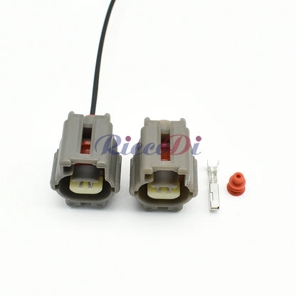 Close-up of motor shock sensor connector showing pin and socket interface for stable automotive wiring