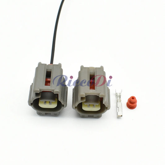 Close-up of motor shock sensor connector showing pin and socket interface for stable automotive wiring