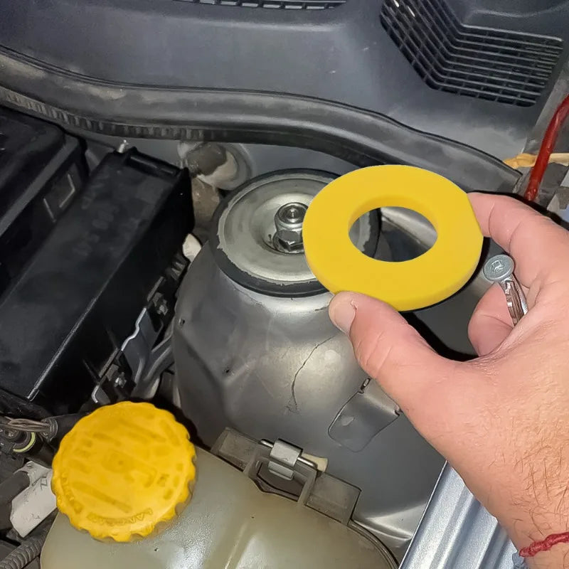Shock-absorbing bearing washer for suspension bump and vibration protection