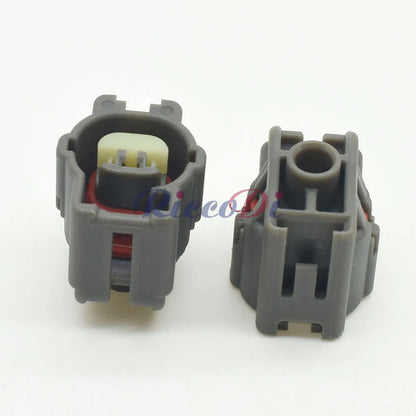 Motor shock sensor connector attached to cable for secure and durable automotive wiring harness connection