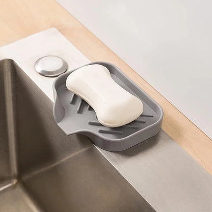 Close-up of kitchen faucet mat and sink tray, soap dispenser sponge pad for drying and countertop storage
