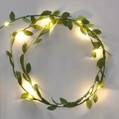 Decorative solar LED string lights with artificial green leaves for indoor and outdoor Christmas décor