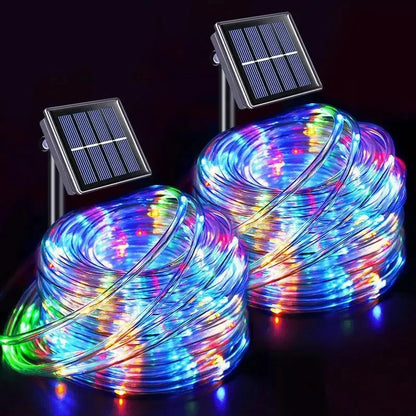 Close-up of solar LED outdoor light string, rope fairy tube for garden, terrace, and Christmas tree decoration
