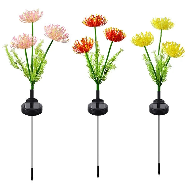 Red magic lily solar LED flower lamp illuminating lawn, yard, and garden
