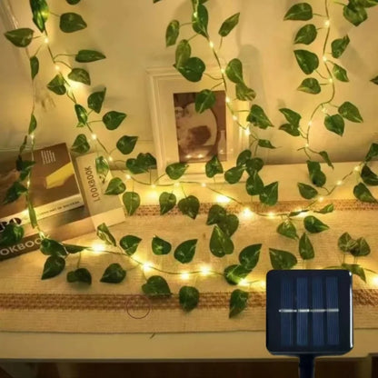 2026 solar vine string lights, 50/100/150 LED green fairy lights with pothos leaves for wedding, Christmas, and home wall decoration