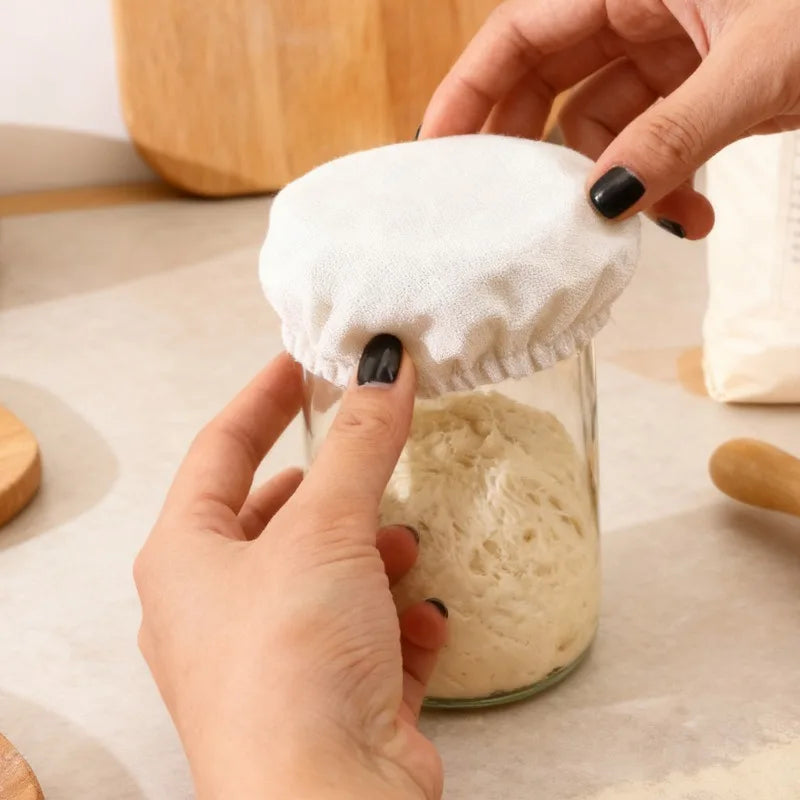 Close-up of elastic cloth cover for sourdough starter jar, reusable and breathable