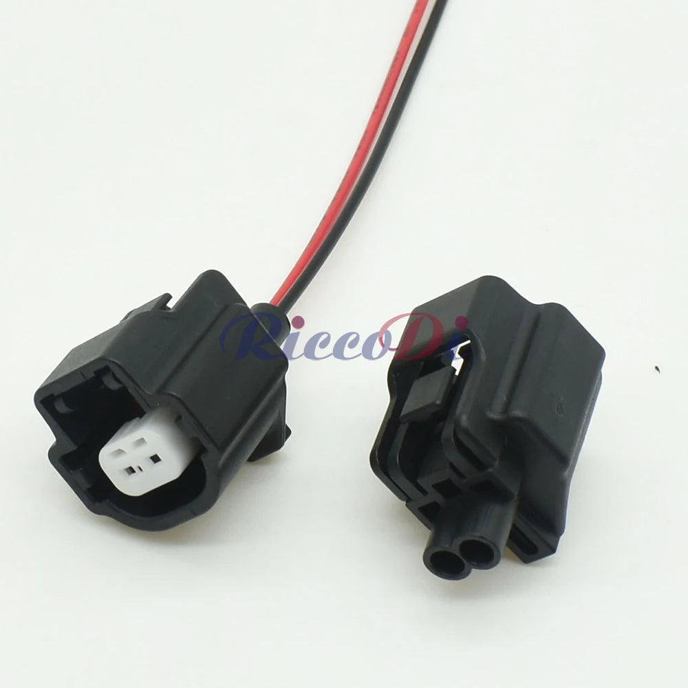 Close-up view of automotive temperature sensor connector showing secure waterproof socket interface