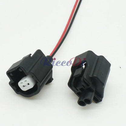 Close-up view of automotive temperature sensor connector showing secure waterproof socket interface