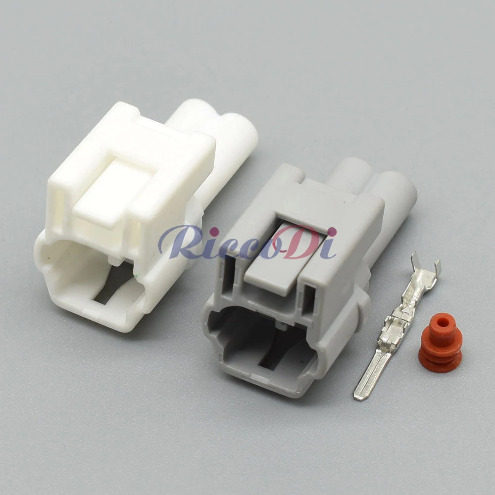 Close-up of automotive unsealed wire harness connector showing precise socket interface