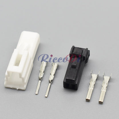 Close-up of automotive unsealed wire harness connector showing precise socket interface